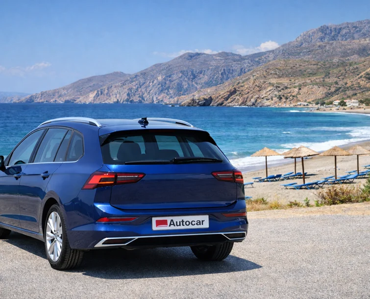Vehicle parked on the side of the road next to a beach